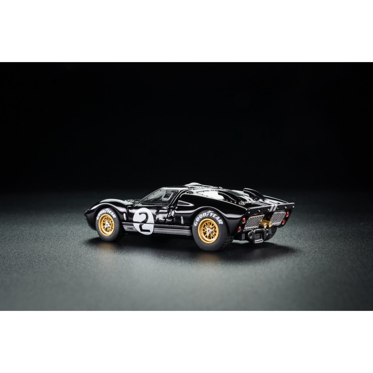 Lot57Supplies Diecast Shop G&KH Ford GT40 Mk II #2 diecast model car in black with gold wheels, side view