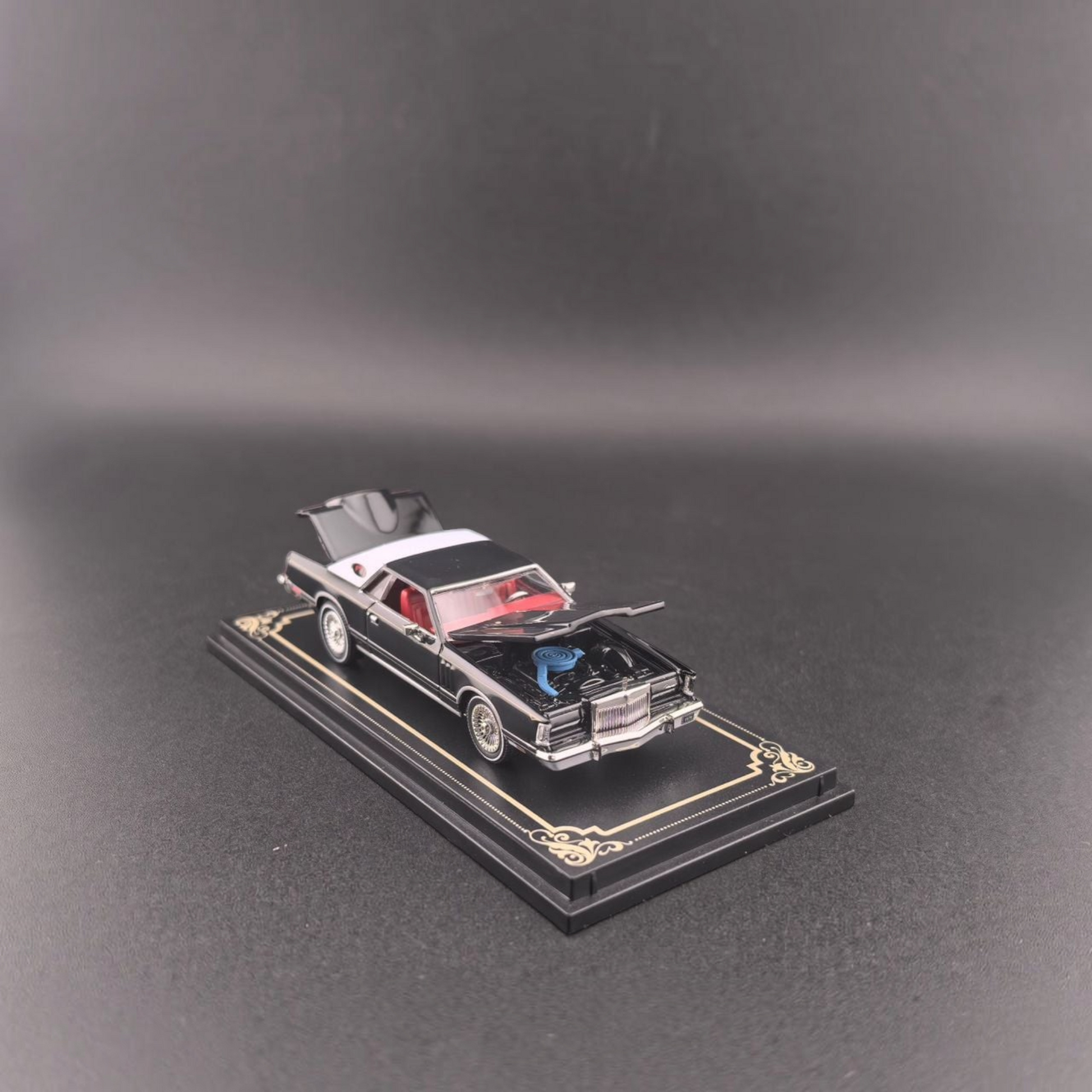 Lot57Supplies Diecast Shop 1:64 scale black 1979 Lincoln Continental diecast model car with open hood and trunk