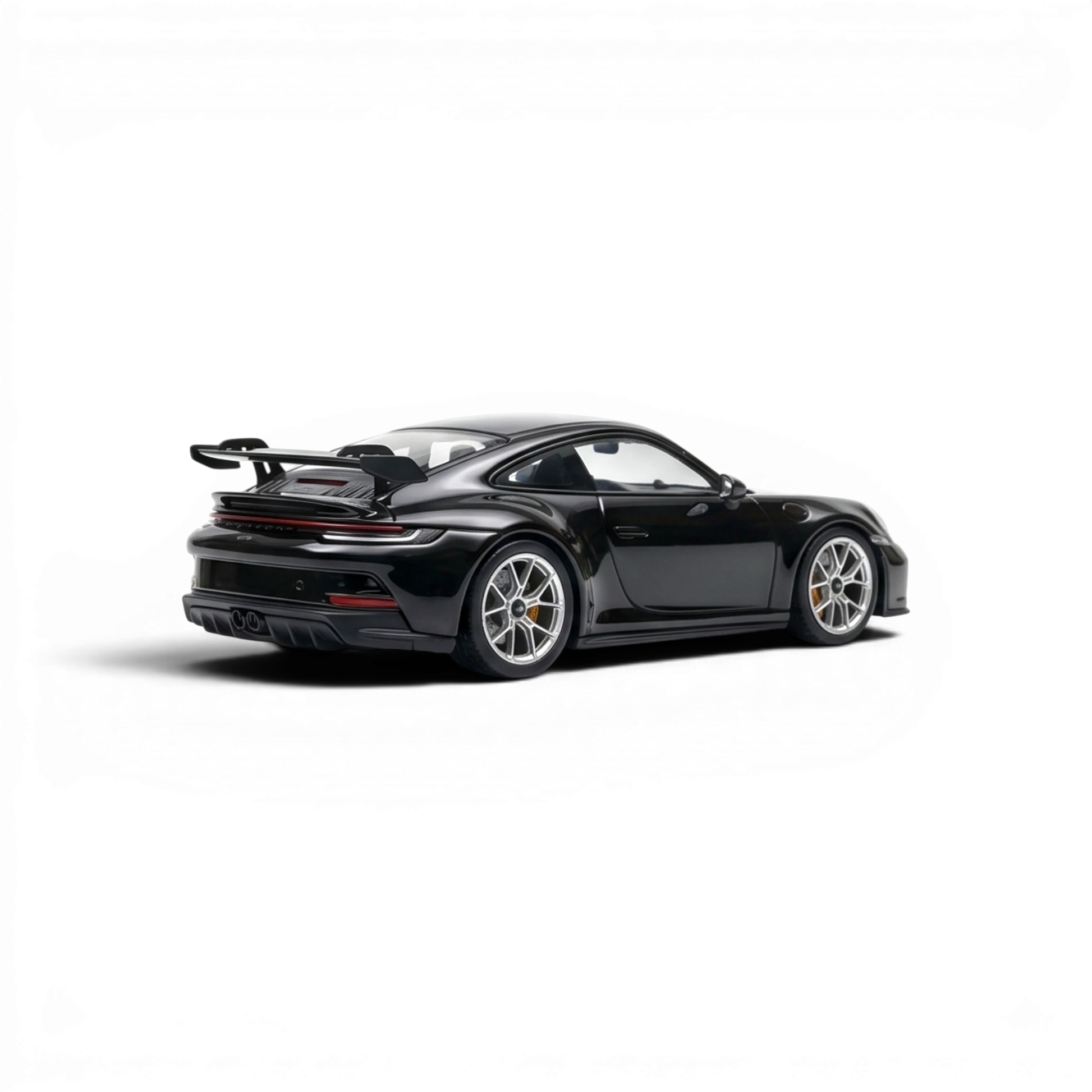 Lot57Supplies Diecast Shop black 1:64 scale resin Porsche 911 GT3 model with silver wheels and large rear spoiler.