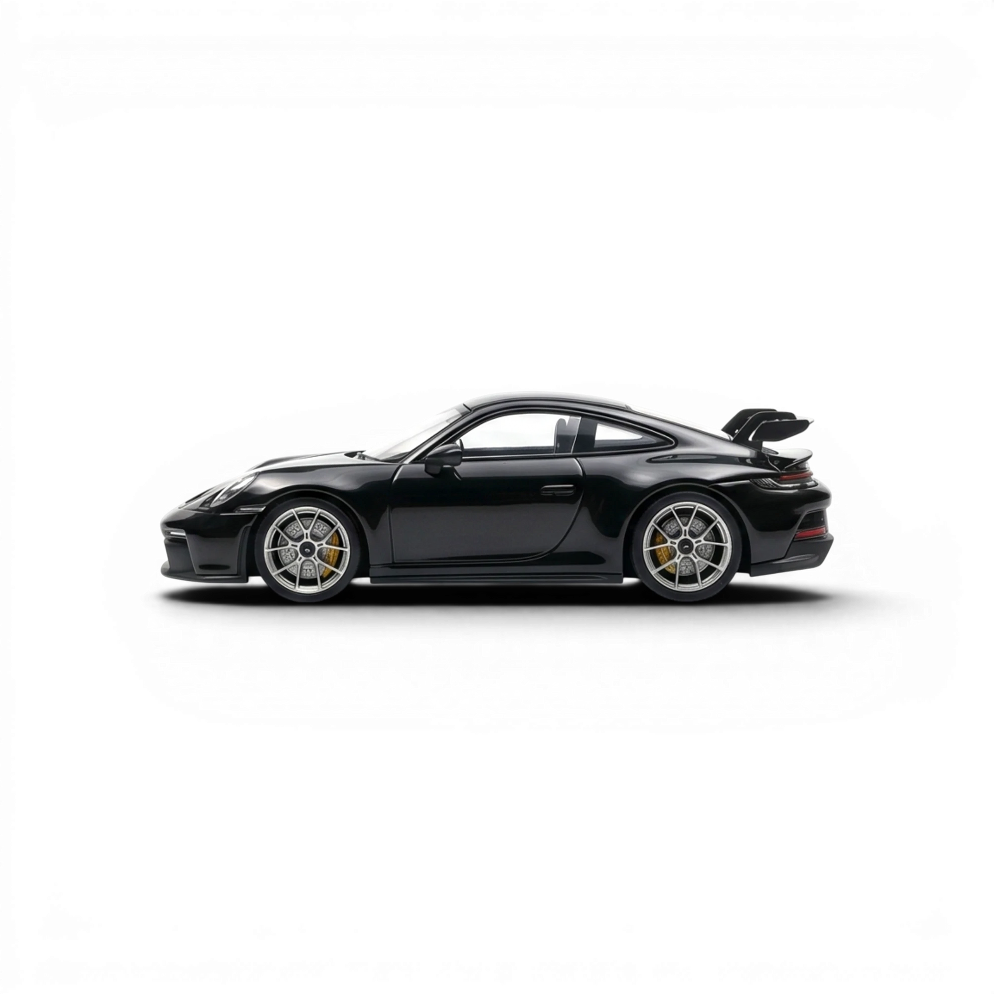 Lot57Supplies Diecast Shop black 1:64 scale resin Porsche 911 GT3 model with yellow brake calipers and a large rear spoiler.