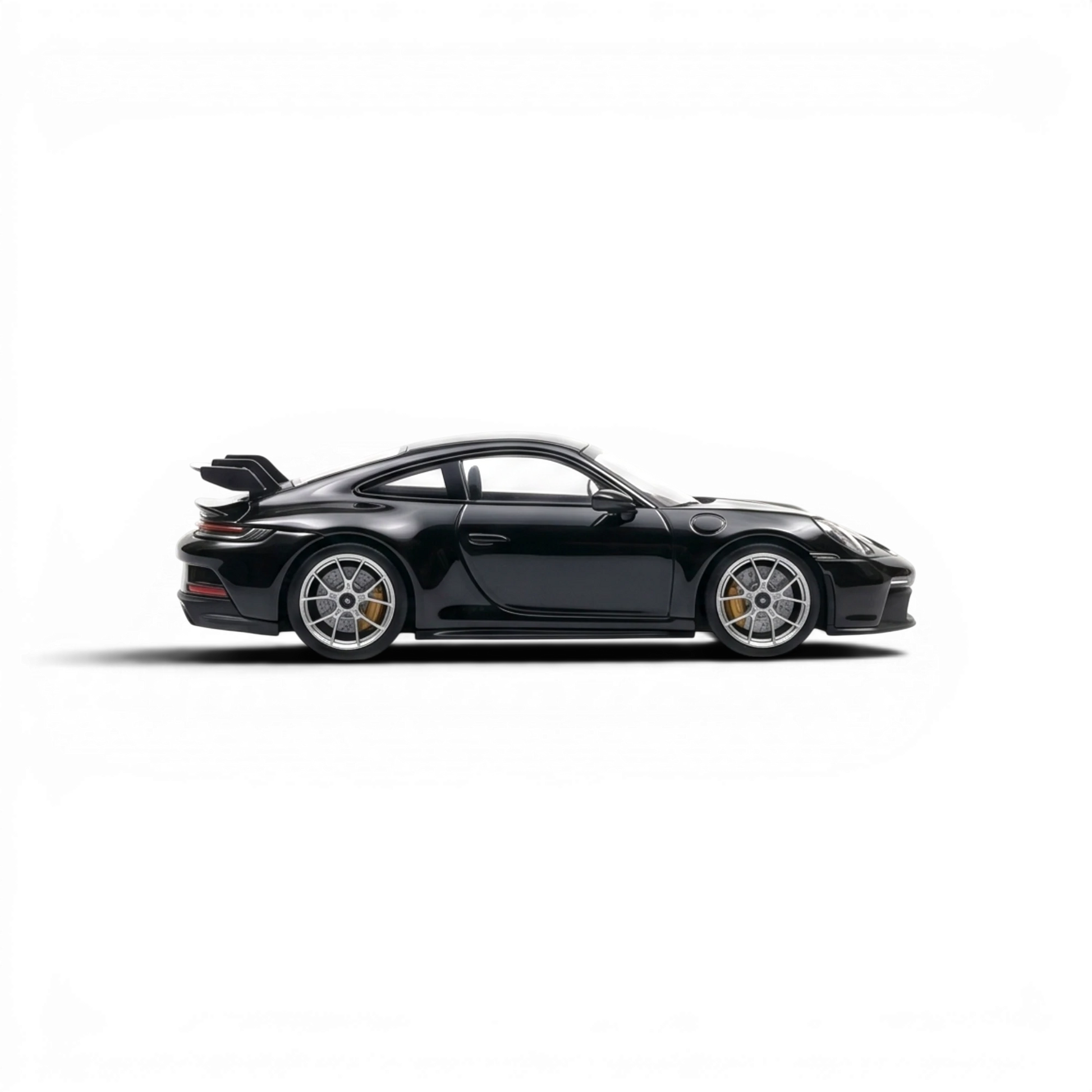 Lot57Supplies Diecast Shop black 1:64 scale resin Porsche 911 GT3 model with silver wheels and yellow brake calipers.
