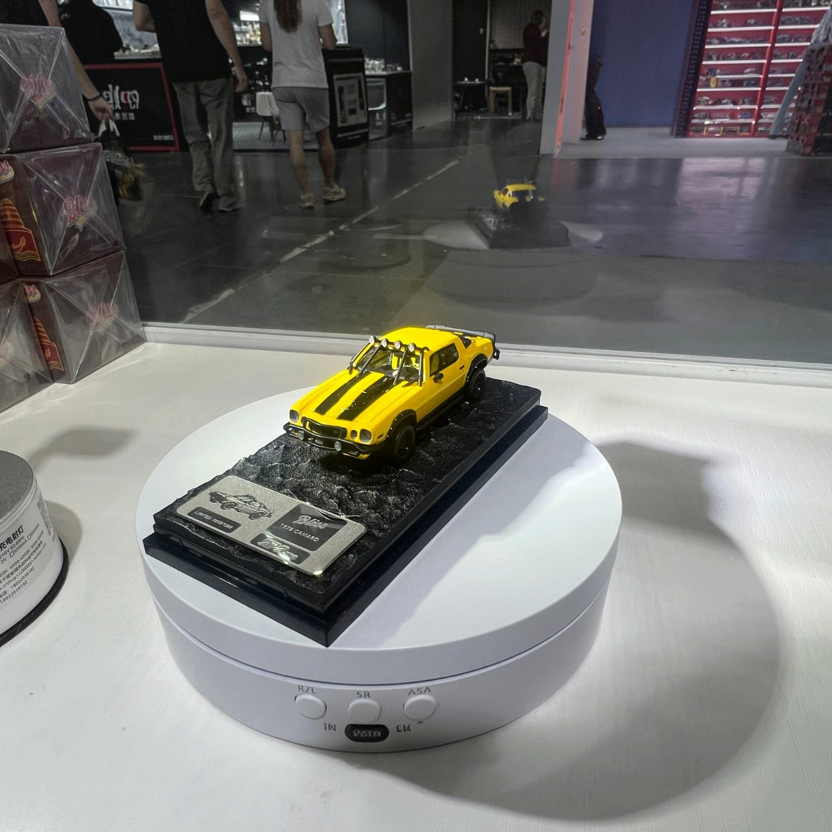 Lot57Supplies Diecast Shop bliss 1:64 scale yellow 1978 Camaro Bumblebee diecast model on a textured display base