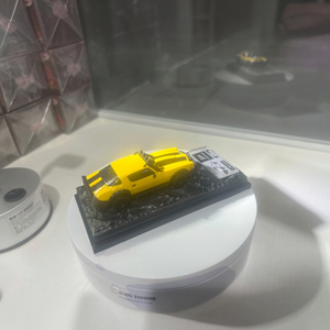 Lot57Supplies Diecast Shop yellow 1978 Camaro Bumblebee diecast model car on a textured display base