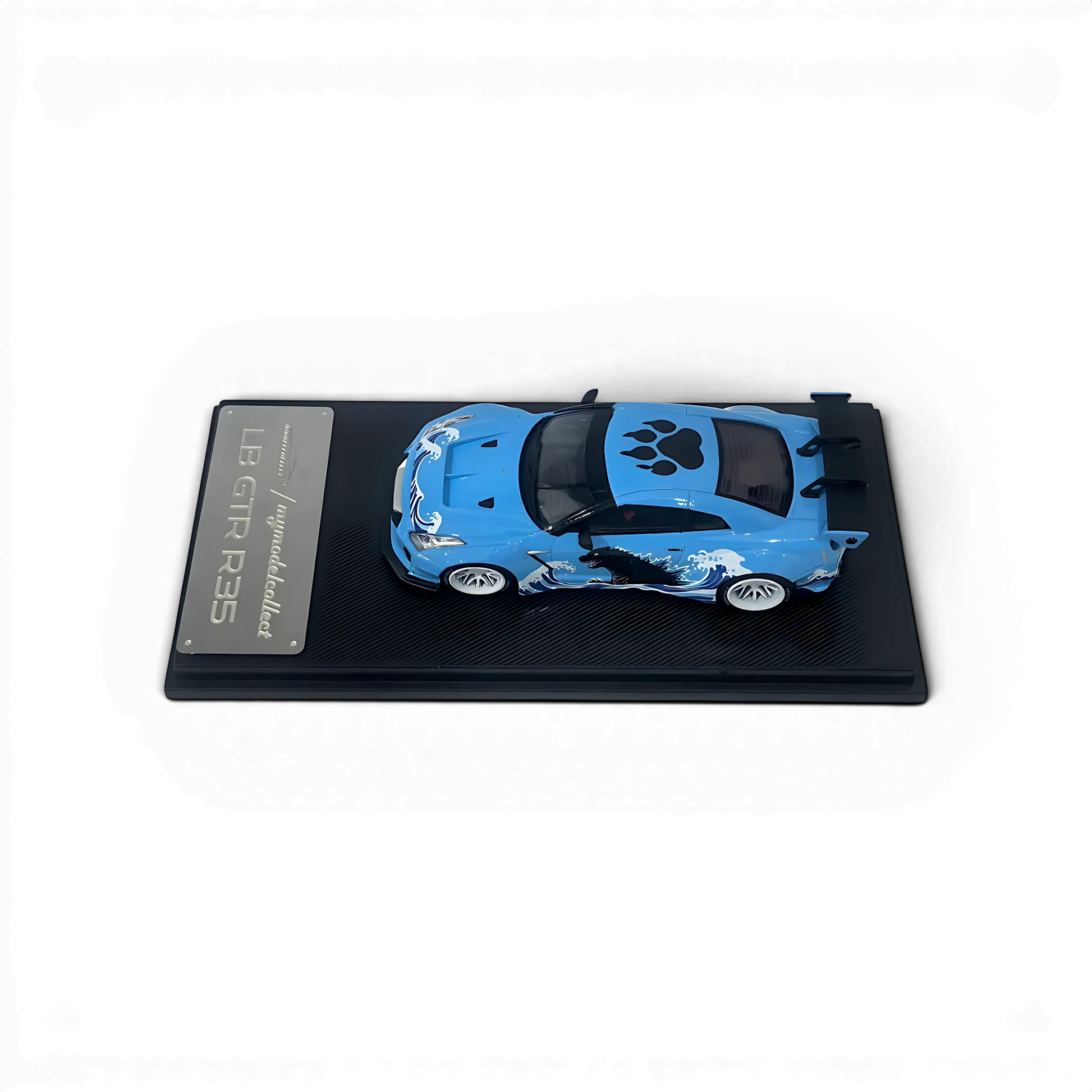Lot57Supplies Diecast Shop 1:64 scale MC LB GTR 1.5v diecast model car in blue with Godzilla livery and white wheels.
