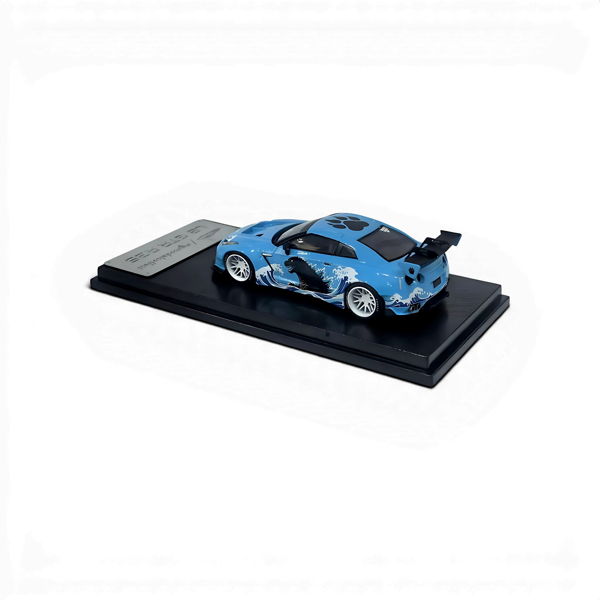 Lot57Supplies Diecast Shop 1:64 scale MC LB GTR 1.5v diecast car in blue with Godzilla wave livery on display base