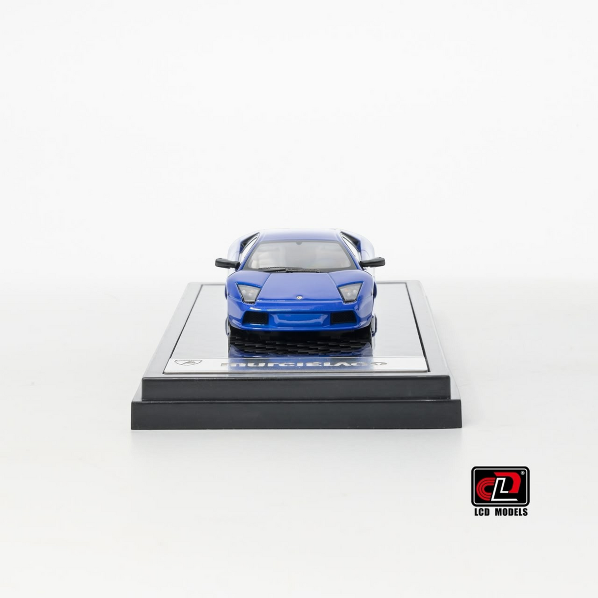 Lot57Supplies Diecast Shop 1:64 scale blue LCD Lamborghini Murciélago diecast model car on a display base