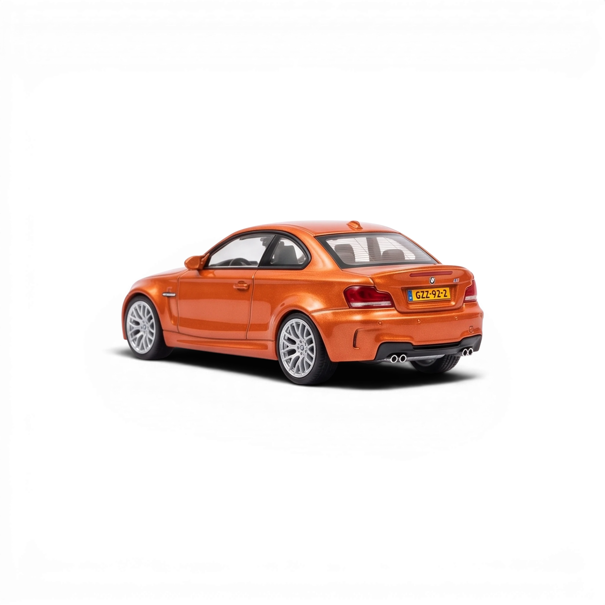 Lot57Supplies Diecast Shop MORTAL 1:64 scale diecast BMW 1M Coupe in Valencia Orange, rear three-quarter view.