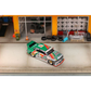 Lot57Supplies Diecast Shop GHOST PLAYER BMW E30 1:64 scale diecast model car in 7-Eleven livery parked in a garage diorama