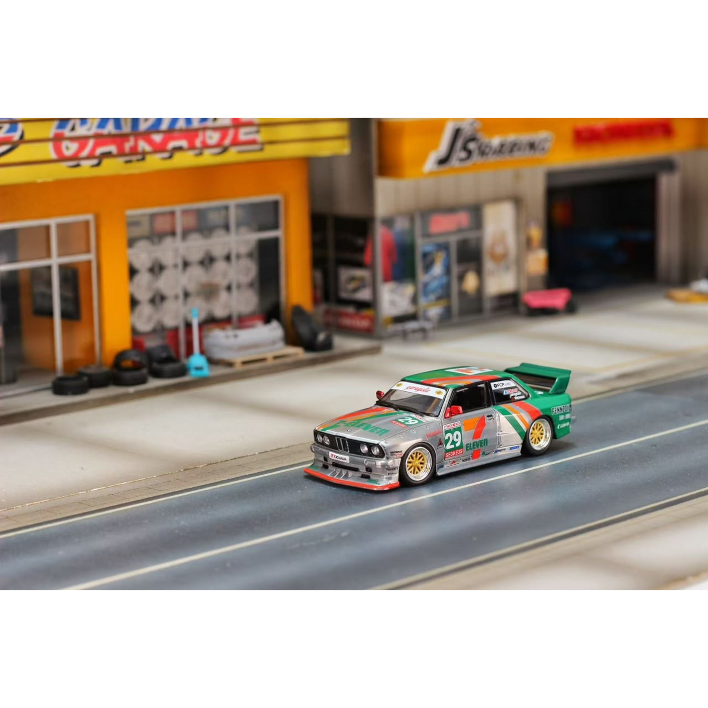 Lot57Supplies Diecast Shop 1:64 scale GHOST PLAYER BMW E30 diecast model in silver and green 7-Eleven racing livery