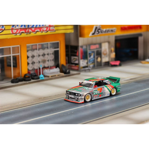 Lot57Supplies Diecast Shop 1:64 scale GHOST PLAYER BMW E30 diecast model in silver and green 7-Eleven racing livery