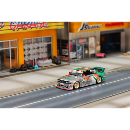 Lot57Supplies Diecast Shop 1:64 scale GHOST PLAYER BMW E30 diecast model in silver and green 7-Eleven racing livery