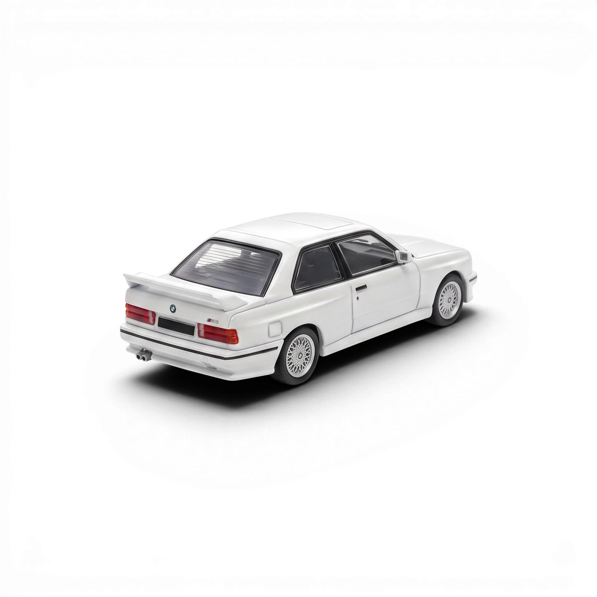 Lot57Supplies Diecast Shop Mortal 1:64 scale pearl white BMW E30 M3 diecast model car, rear three-quarter view.