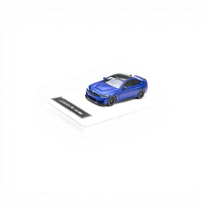 Lot57Supplies Diecast Shop 1:64 scale Frozen Dark Blue BMW F82 M4 CS model car with black roof and wheels.