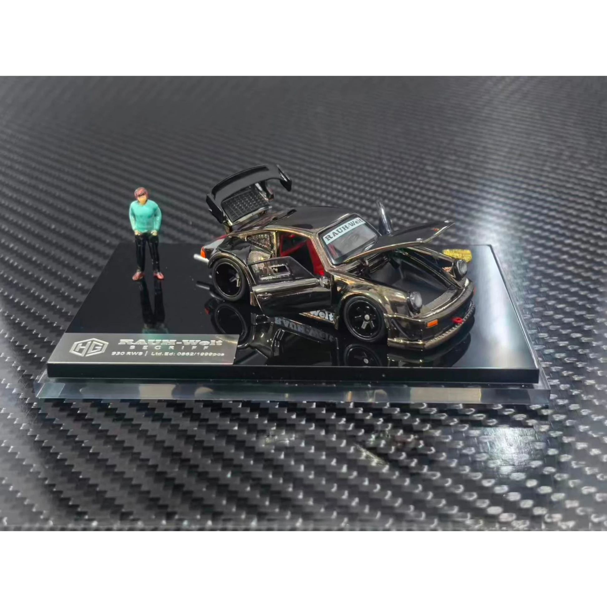 Lot57Supplies Diecast Shop 1:64 scale chrome gunmetal RWB930 diecast model car with opening parts and a small figure