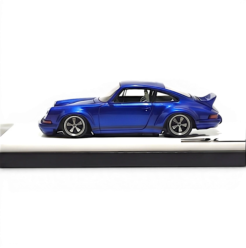 Lot57Supplies Diecast Shop DeepMaker Singer DLS 1:64 scale blue metallic resin model car with wing spoiler on display base.
