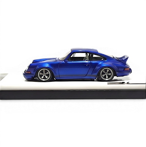Lot57Supplies Diecast Shop DeepMaker Singer DLS 1:64 scale blue metallic resin model car with wing spoiler on display base.