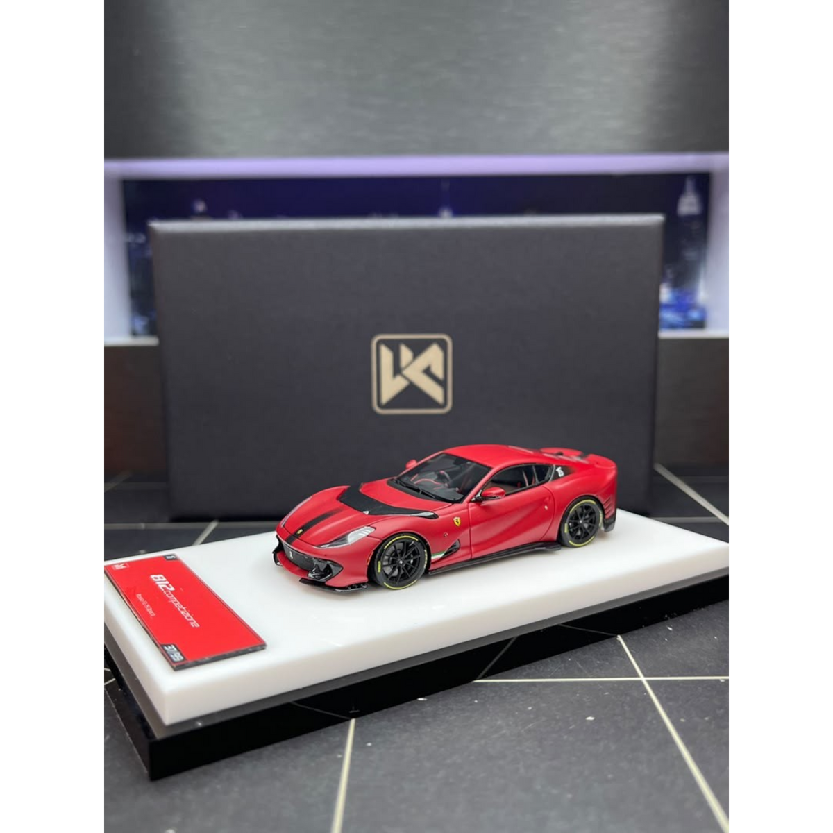Lot57Supplies Diecast Shop DMY Ferrari 812C matte red 1:64 scale model car with opening hood on display base