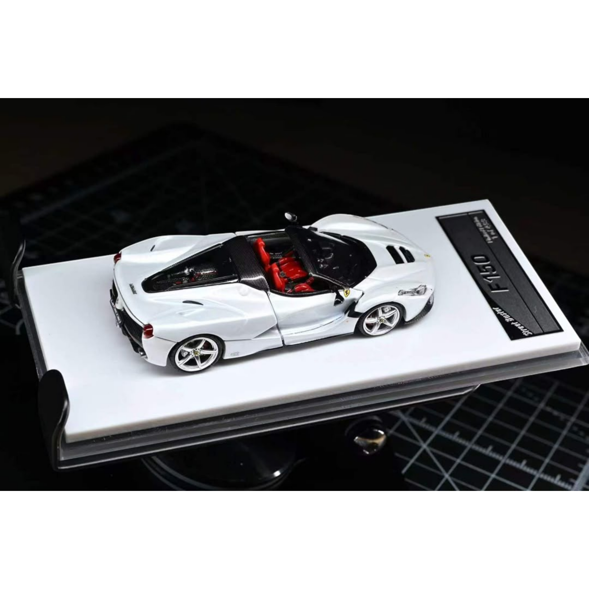 Lot57Supplies Diecast Shop 1:64 scale Street Buster F150 Aperta diecast model car in white with red interior