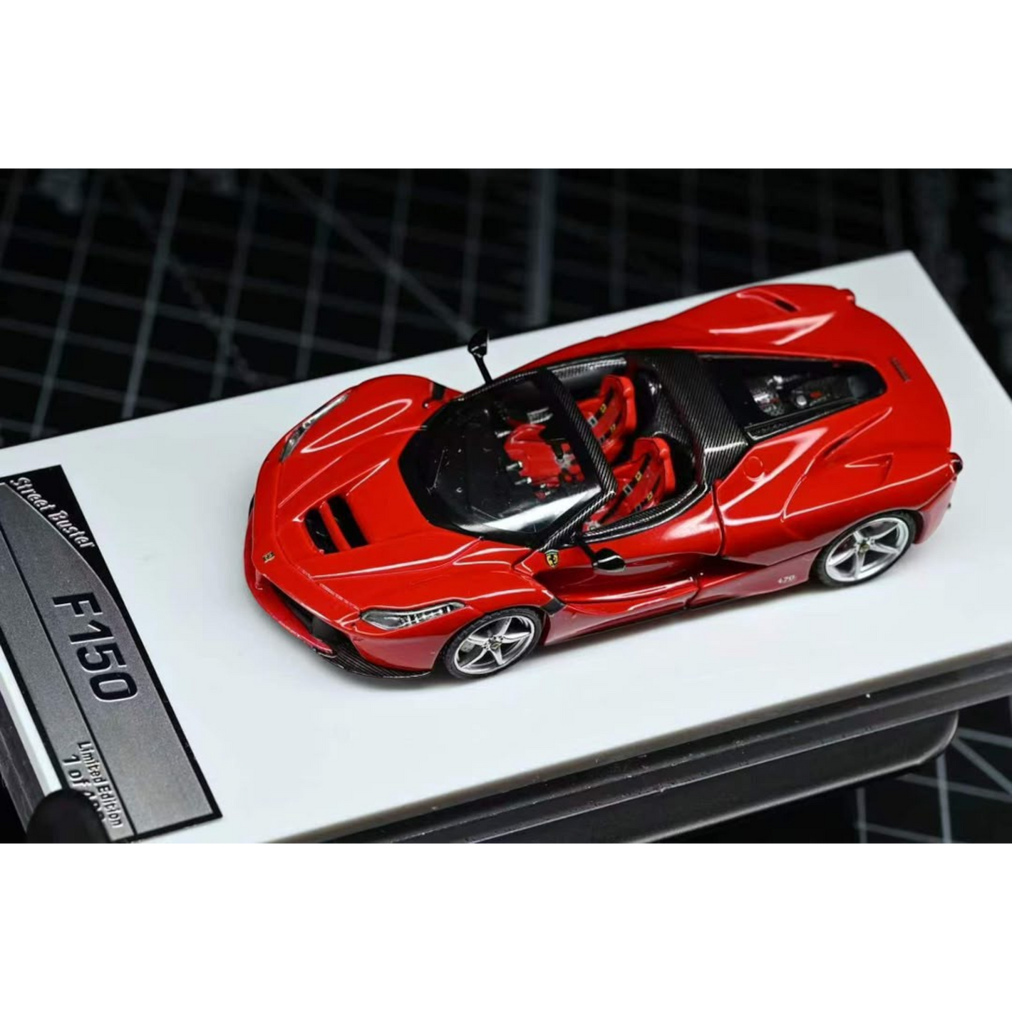 Lot57Supplies Diecast Shop 1:64 scale Street Buster F150 supercar in Rosso Corsa red with a matching red interior.
