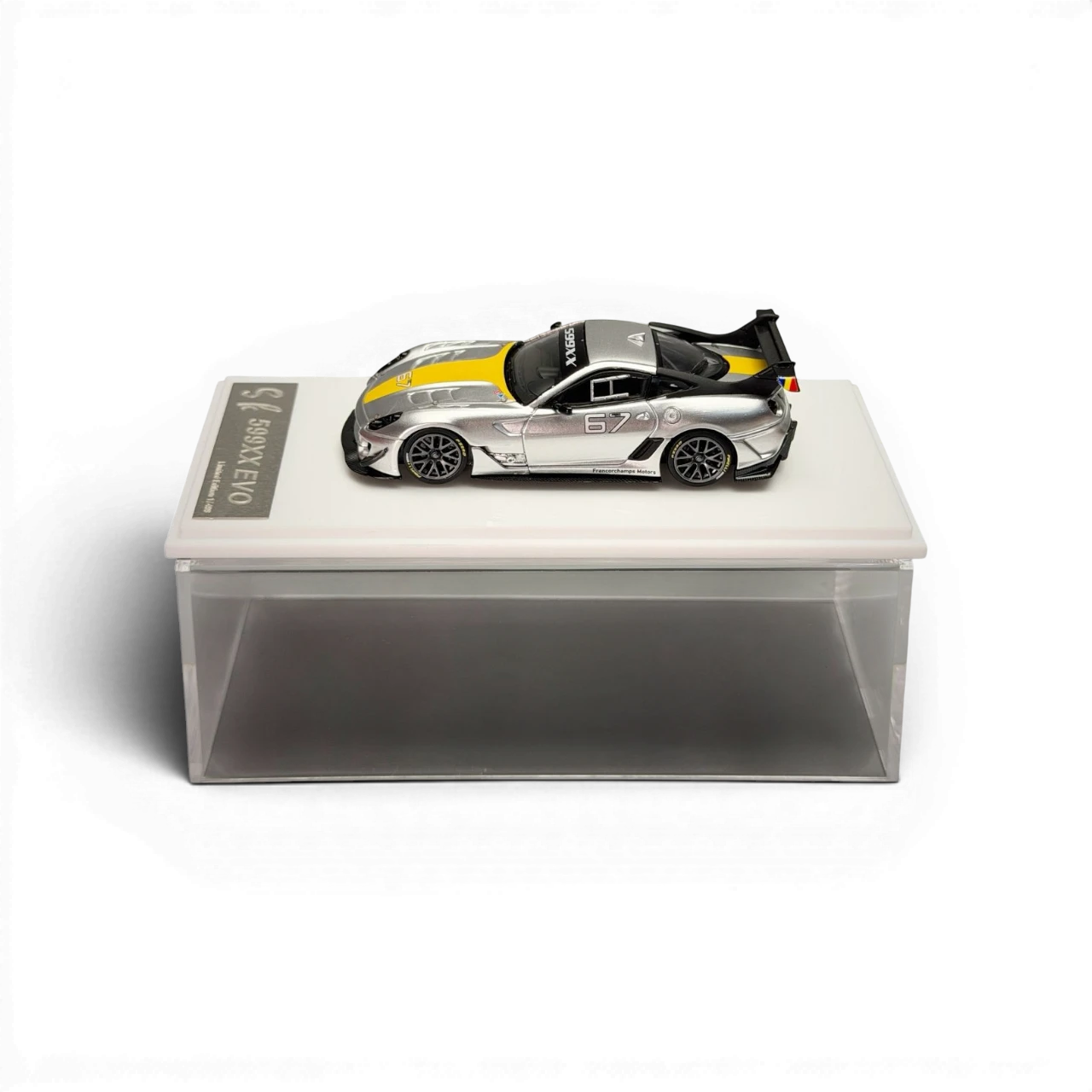 Lot57Supplies Diecast Shop metallic silver Ferrari 599XX EVO 1:64 scale model with yellow racing stripes and #67 detail.