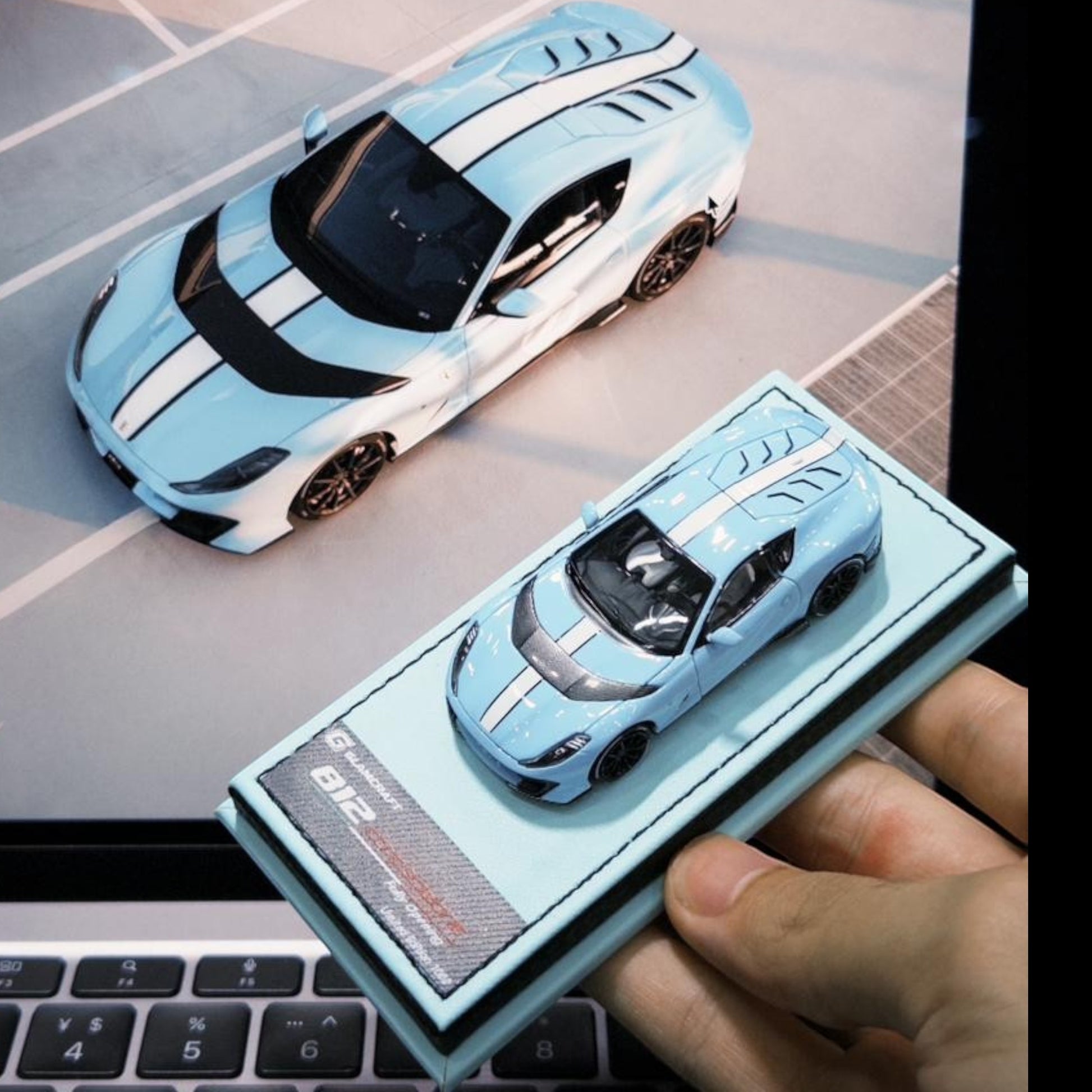 Lot57Supplies Diecast Shop GLAMCRAFT Ferrari 812 Competizione 1:64 scale diecast model in light blue with white stripes