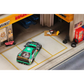Lot57Supplies Diecast Shop GHOST PLAYER Ferrari F40 1:64 scale diecast model in 7-Eleven livery parked in a garage diorama