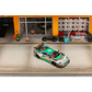 Lot57Supplies Diecast Shop GHOST PLAYER Ferrari F40 1:64 scale diecast model with 7-Eleven livery in a garage diorama