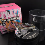Lot57Supplies Diecast Shop Fine Works64 black and gold Impala lowrider diecast car on an electric turntable display