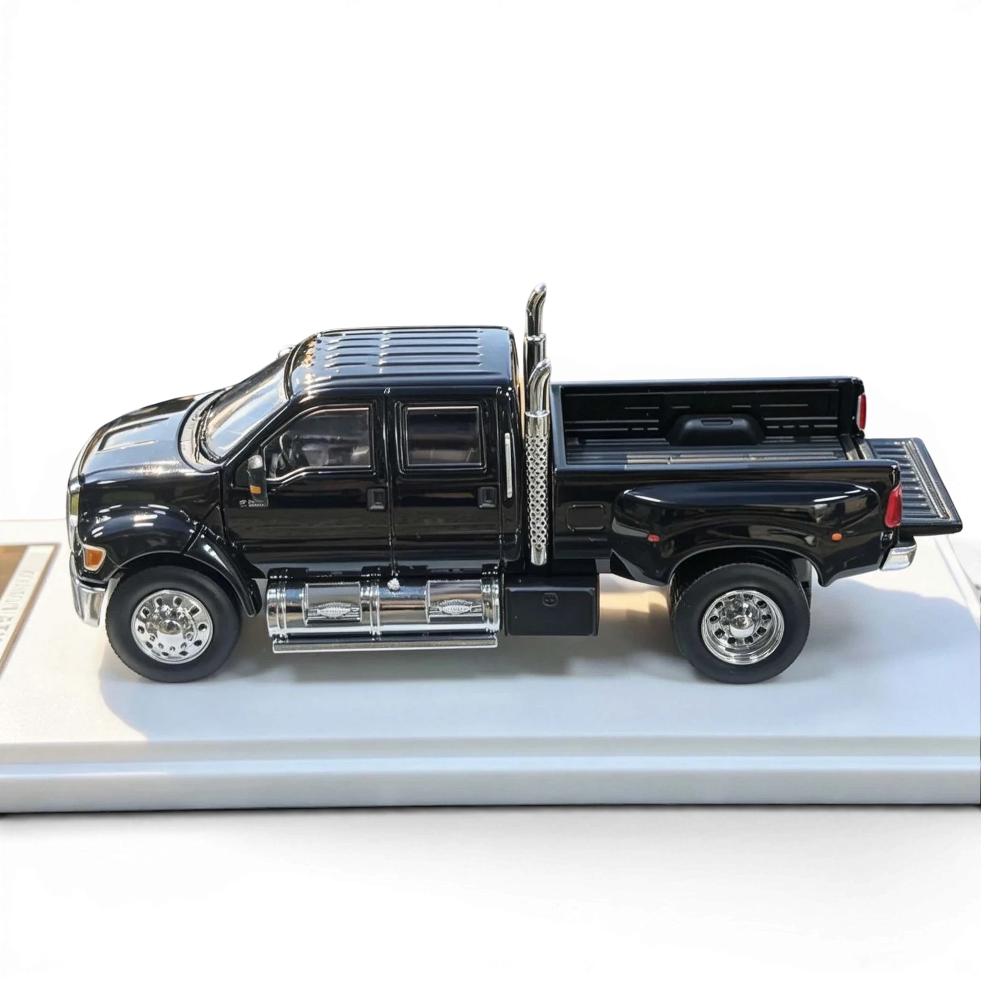 Lot57Supplies Diecast Shop MK Miniatures 1:64 scale Ford F650 Super Duty diecast truck in agate black with open tailgate
