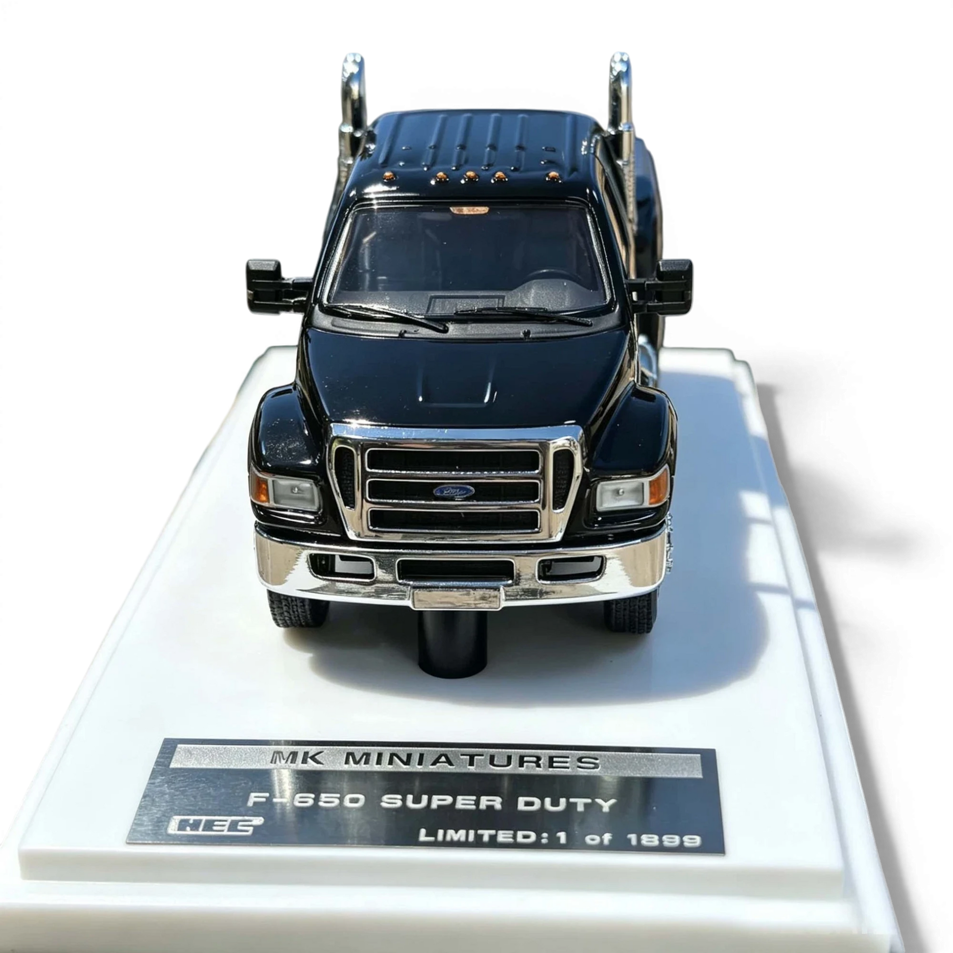 Lot57Supplies Diecast Shop MK Miniatures 1:64 scale Ford F650 Super Duty diecast truck in agate black on display stand