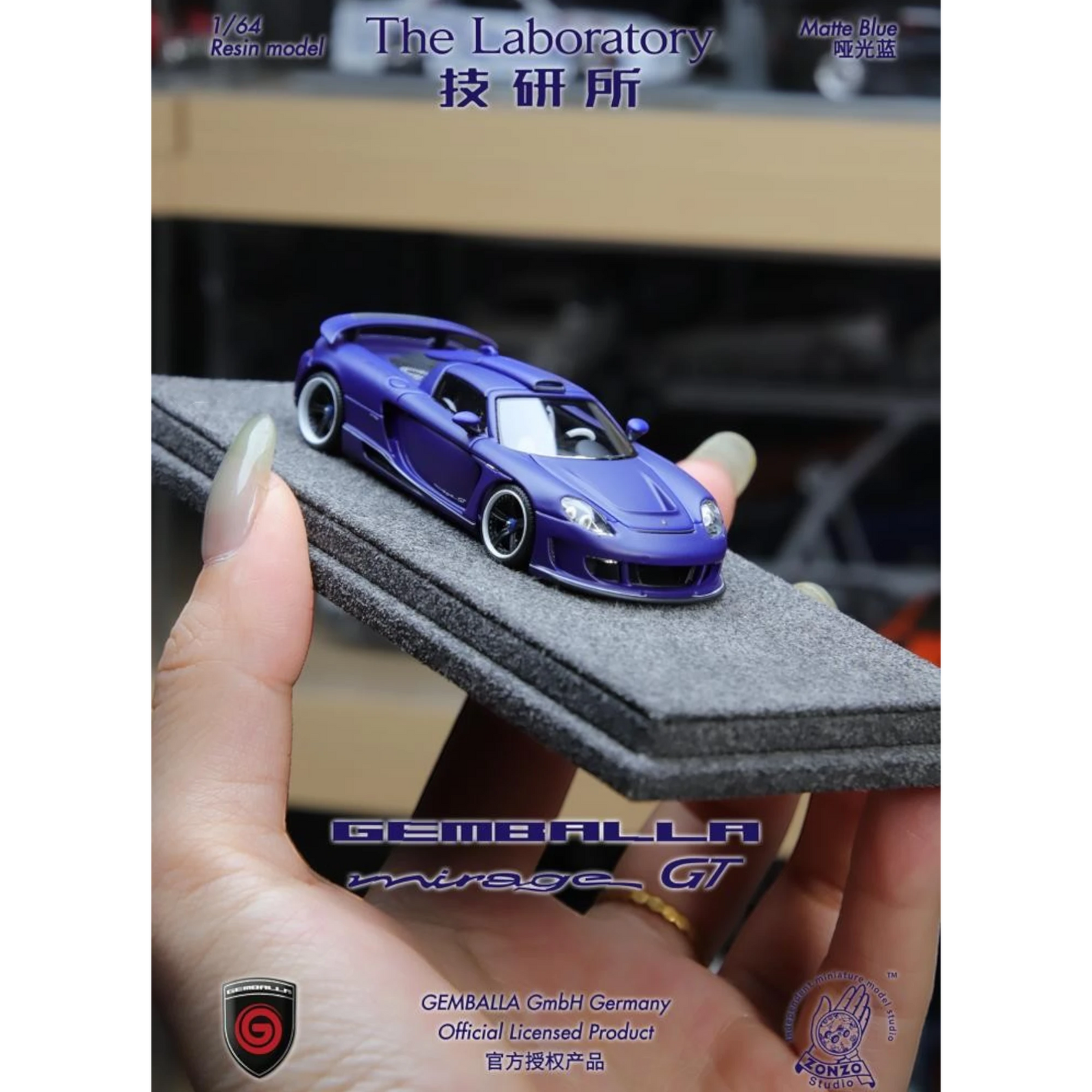 Lot57Supplies Diecast Shop 1:64 scale matte blue resin Gemballa Mirage GT model car on a grey foam display base.