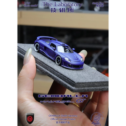 Lot57Supplies Diecast Shop 1:64 scale matte blue resin Gemballa Mirage GT model car on a grey foam display base.