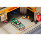 Lot57Supplies Diecast Shop GHOST PLAYER BMW E30 diecast model car in 7-Eleven livery parked in a miniature garage diorama