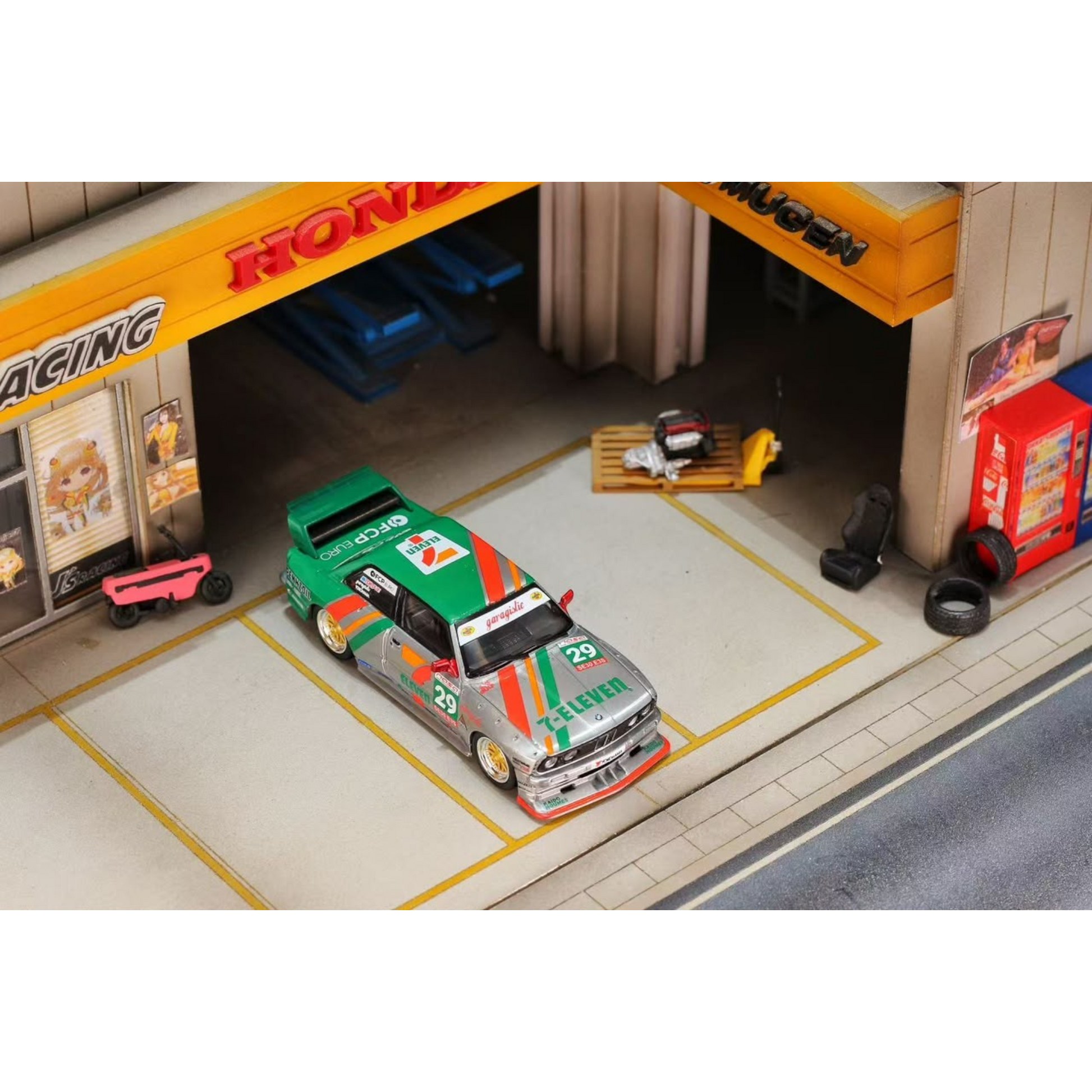 Lot57Supplies Diecast Shop GHOST PLAYER BMW E30 diecast model car in 7-Eleven livery parked in a miniature garage diorama