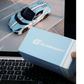 Lot57Supplies Diecast Shop GLAMCRAFT light blue Ferrari 812 Competizione diecast model box on a laptop