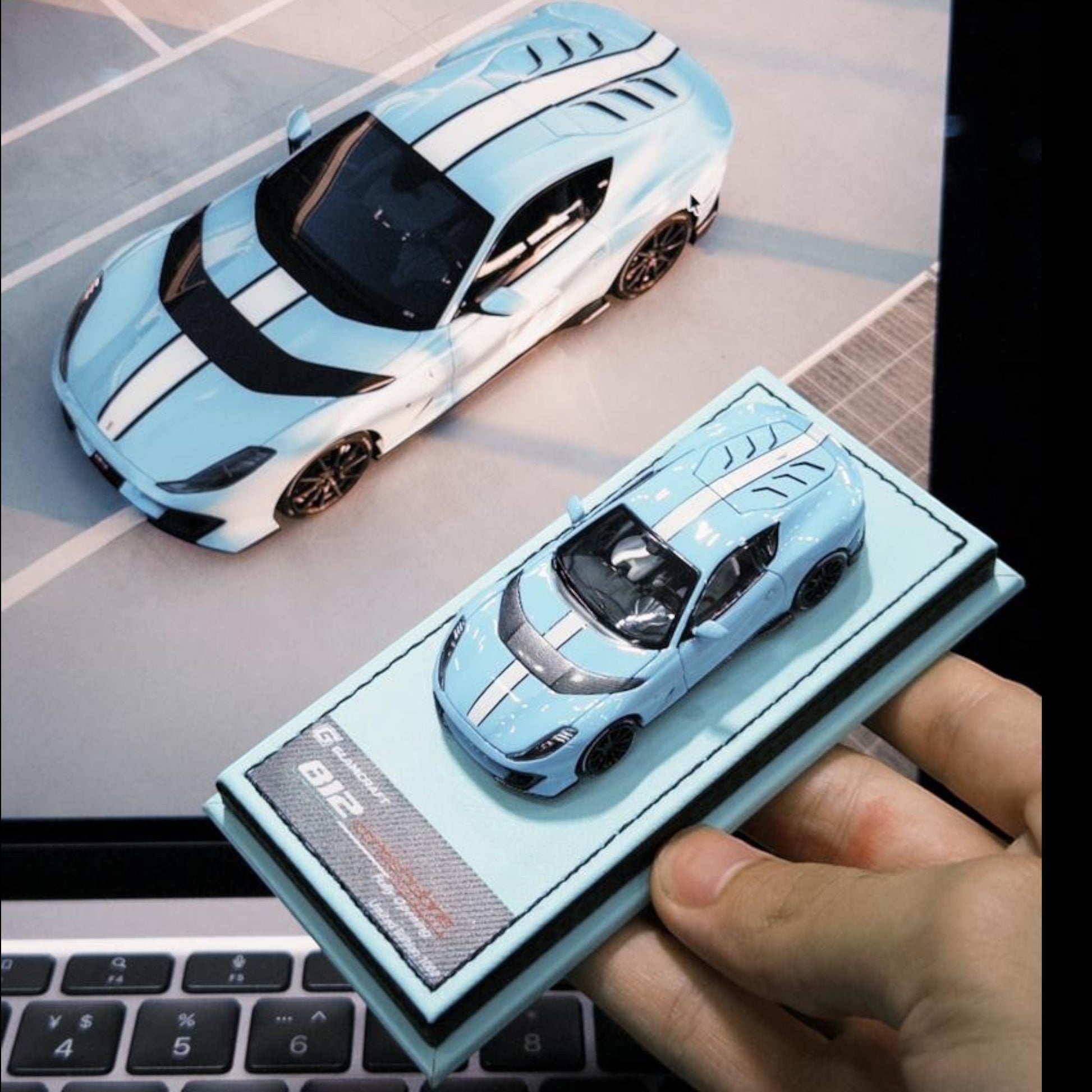 Lot57Supplies Diecast Shop GLAMCRAFT 1:64 scale light blue Ferrari 812 Competizione diecast model with white stripes