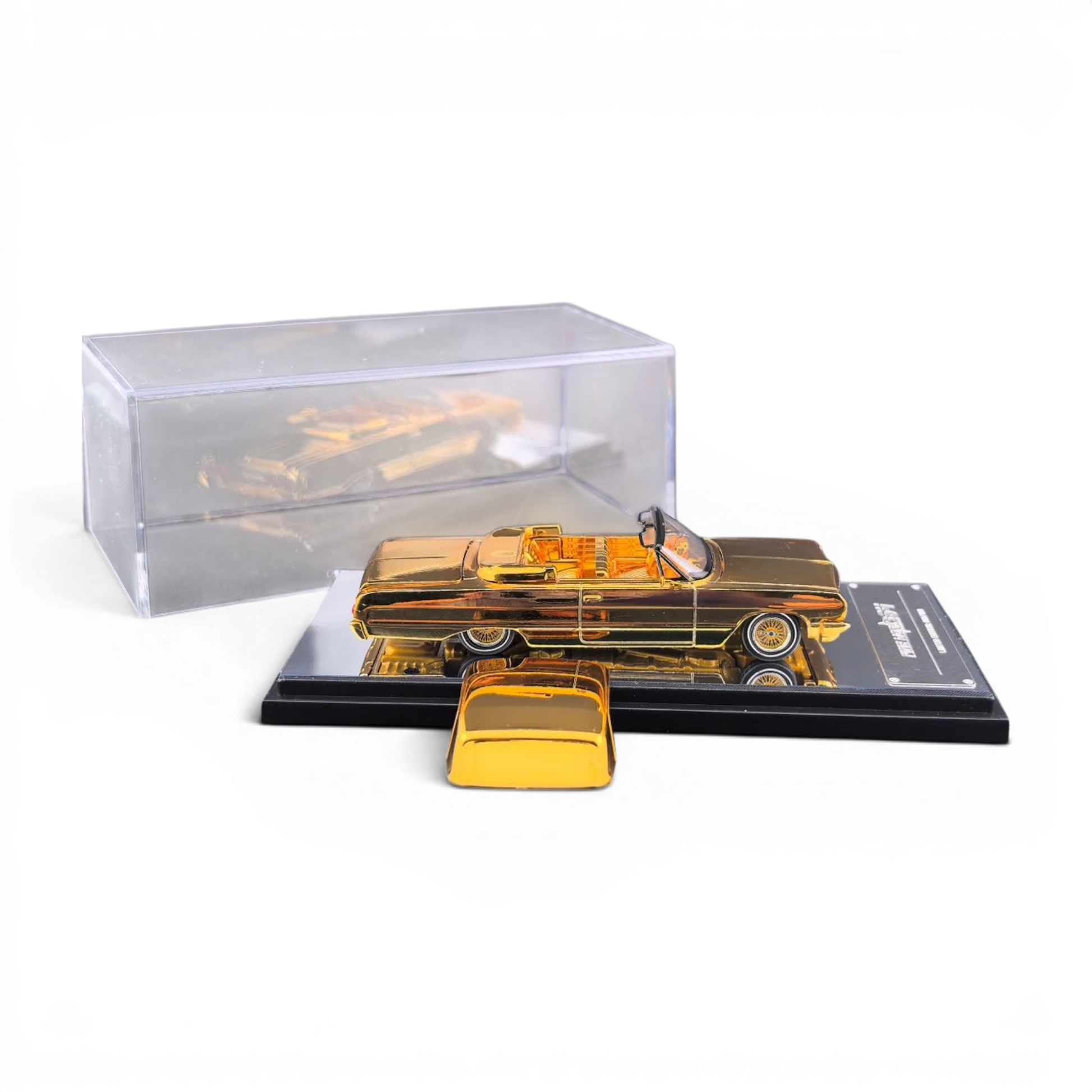 Lot57Supplies Diecast Shop 1:64 scale chrome gold Chevrolet Impala lowrider diecast model with display case