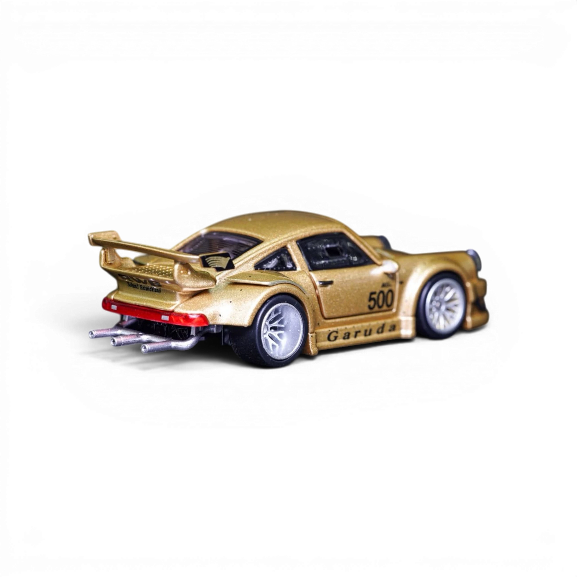 Lot57Supplies Diecast Shop TPC Customized Version RWB930 gold diecast model car in 1:64 scale with rear view