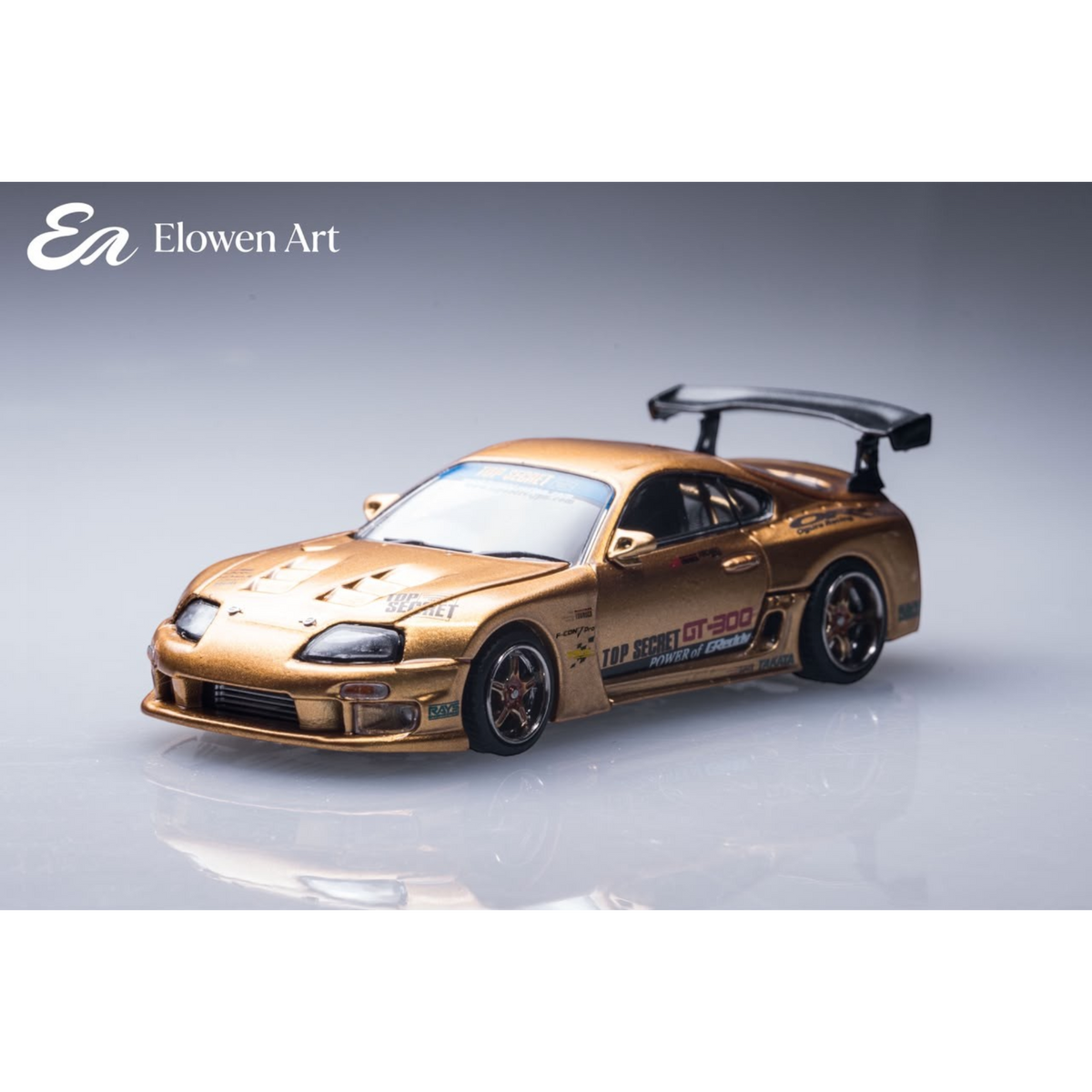 Lot57Supplies Diecast Shop Elowen Art gold 1:64 scale diecast topSecret A80 Supra MK4 model car with rear wing