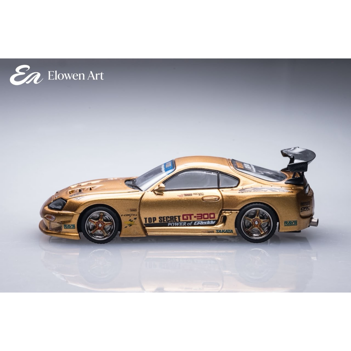 Lot57Supplies Diecast Shop Elowen Art 1:64 scale gold topSecret A80 Supra MK4 diecast model car side view