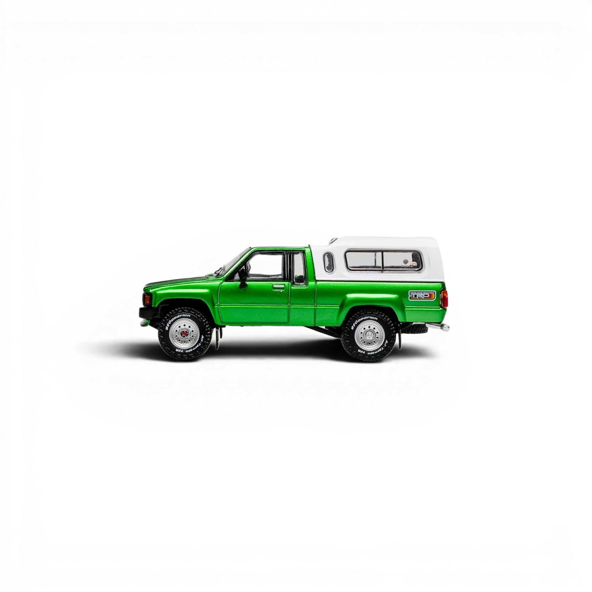 Lot57Supplies Diecast Shop GCD 1:64 scale green Toyota Hilux Xtra Cab diecast pickup truck with white camper shell