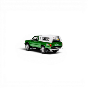 Lot57Supplies Diecast Shop GCD 1:64 scale green Toyota Hilux Xtra Cab diecast pickup truck with white camper shell