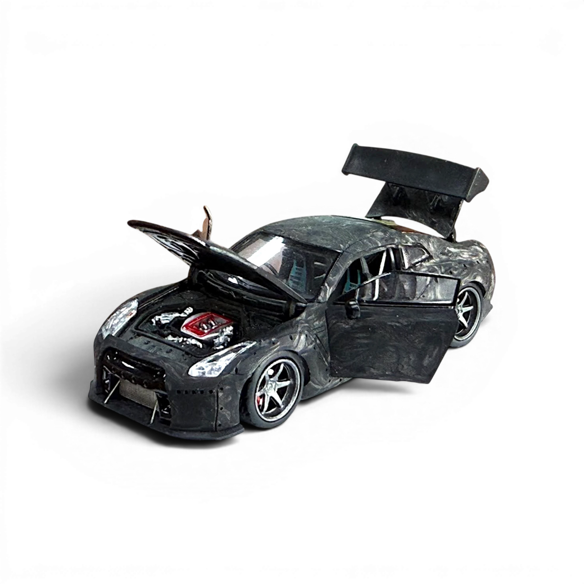 Lot57Supplies Diecast Shop 1:64 scale PGM GTR R35 diecast model car in black carbon fiber with opening doors and hood.