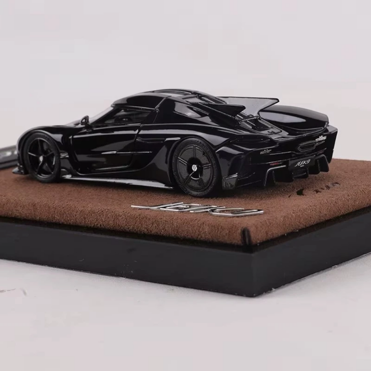 Lot57Supplies Diecast Shop GUO Jesko Absolut 1:64 scale resin model car in jet black on a brown display base.