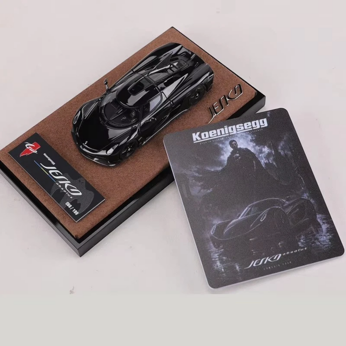 Lot57Supplies Diecast Shop GUO Jesko Absolut 1:64 scale resin model car in jet black on a display base with collector card