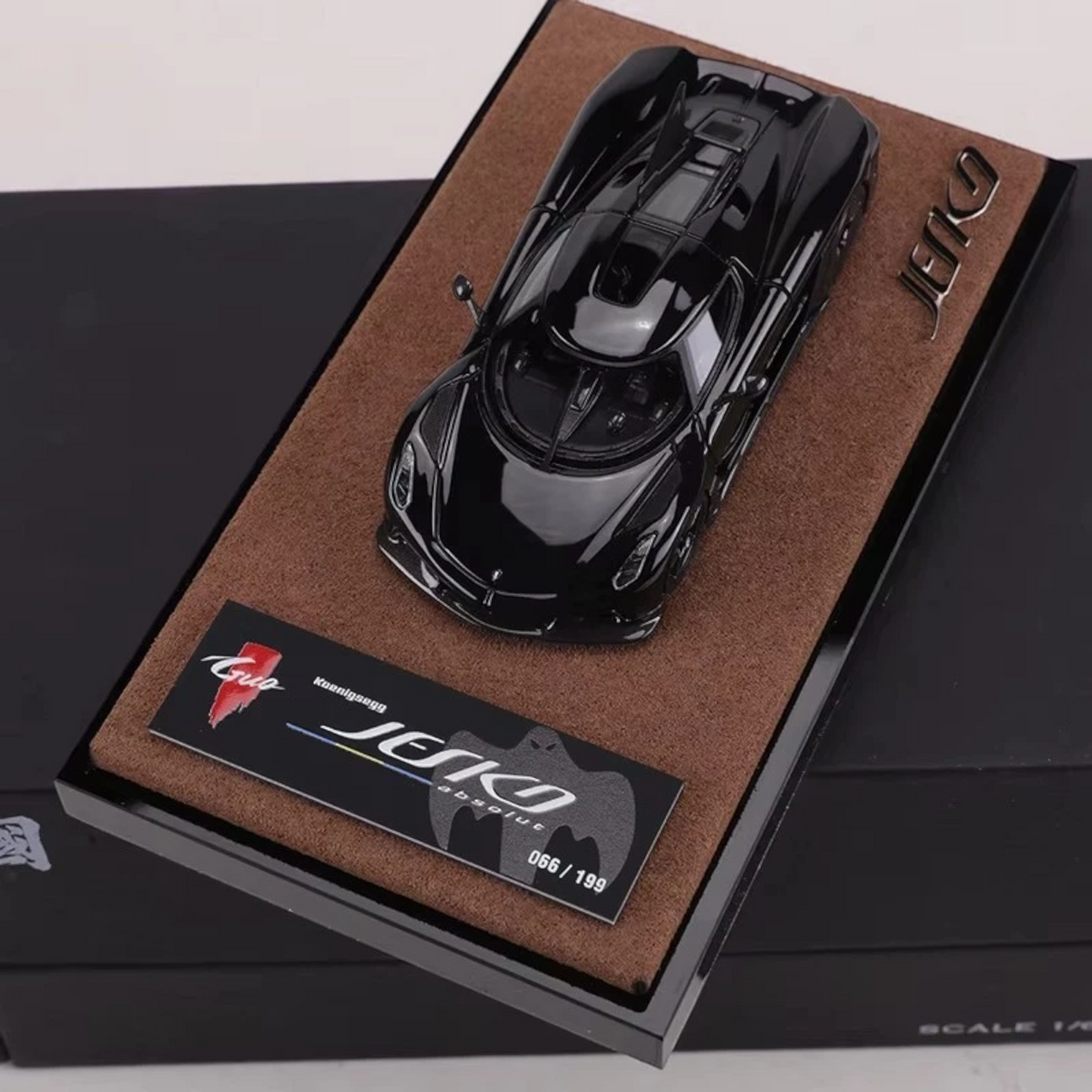 Lot57Supplies Diecast Shop GUO 1:64 scale resin Koenigsegg Jesko Absolut model car in jet black on a display base