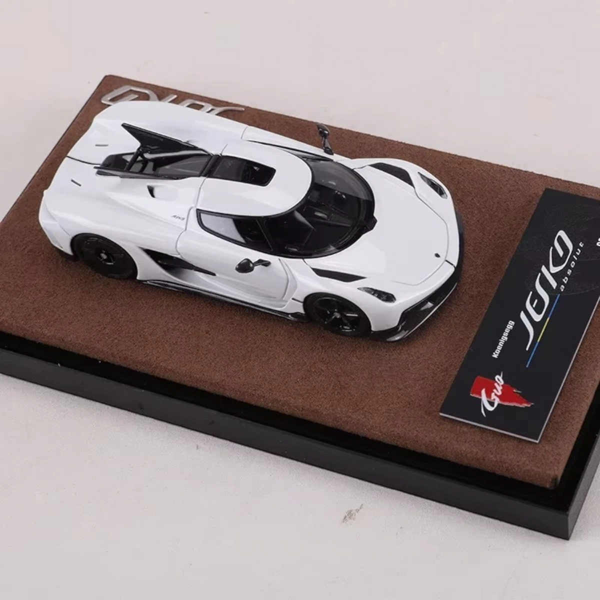 Lot57Supplies Diecast Shop GUO 1:64 scale white resin Koenigsegg Jesko Absolut prototype model car on display base