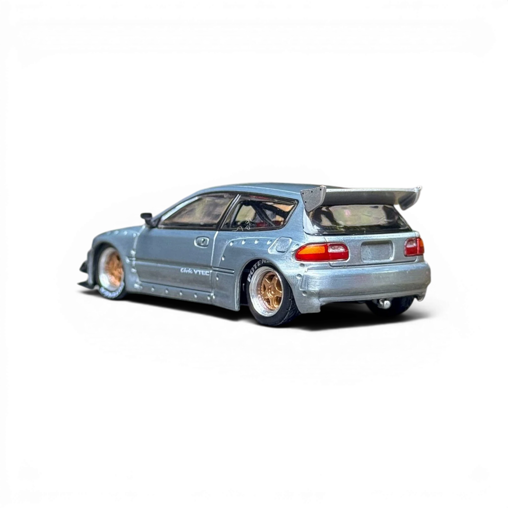 Lot57Supplies Diecast Shop 1:64 scale raw metal Honda Civic EG6 with gold rims and large rear spoiler.
