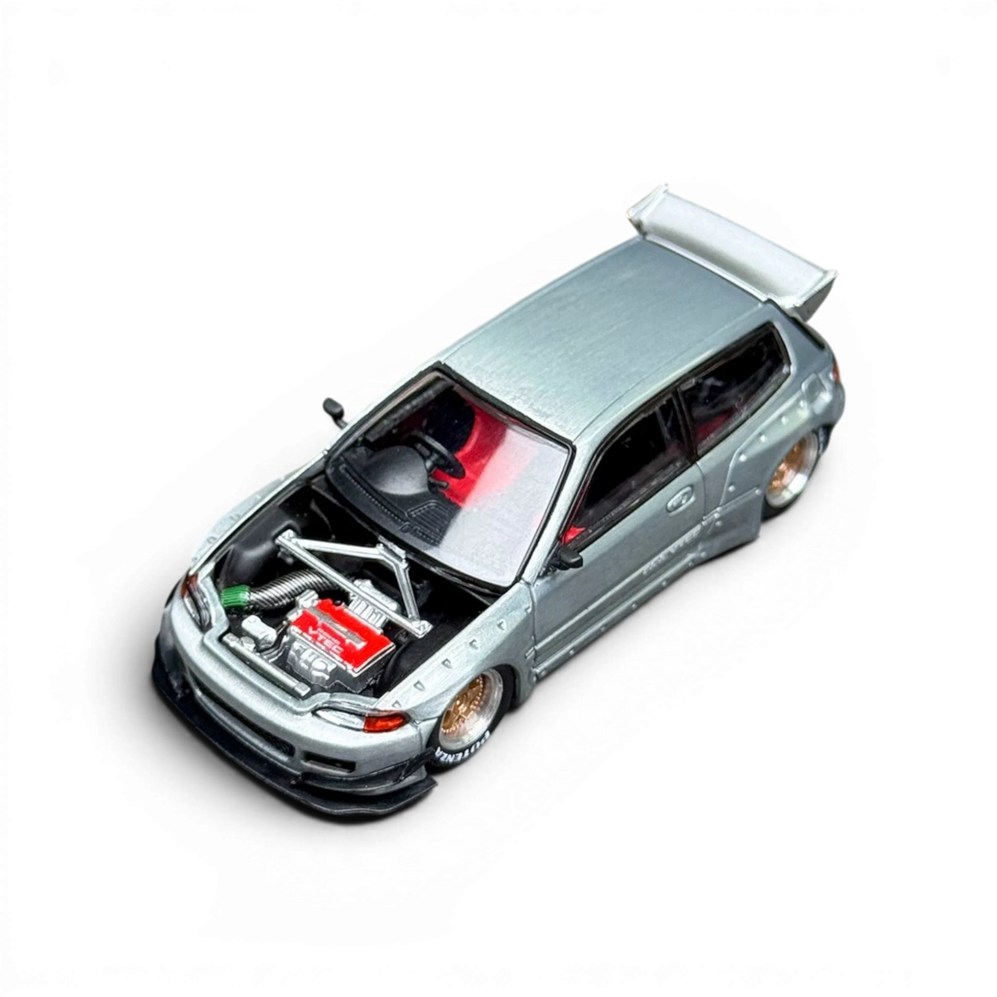 Lot57Supplies Diecast Shop 1:64 scale silver Honda Civic EG6 raw metal model with exposed engine and red interior.