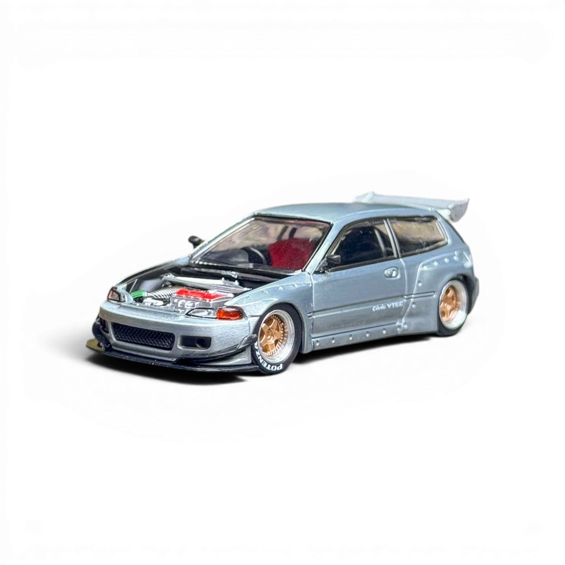 Lot57Supplies Diecast Shop 1:64 scale silver Honda Civic EG6 raw metal model with red interior and gold wheels.